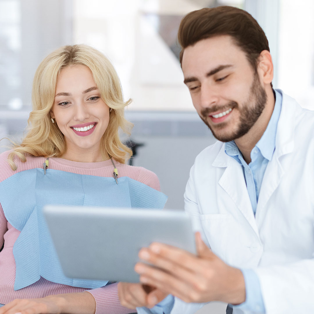 dentist presenting case to patient